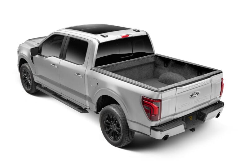 RealTruck 15-26 Ford F150 Super Crew / 17-26 F250/F350 SD Super Cab Traxio 4in Nerf Bars - Tex. Blk