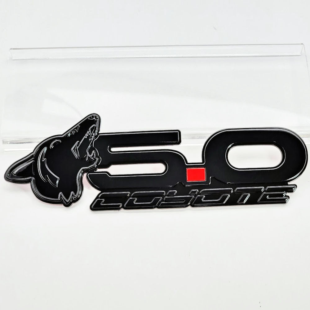 Howling Coyote 5.0 Rear Decklid Emblem Left Coyote - Gloss Black - Fits Mustang & Universal - AMP-85101-23