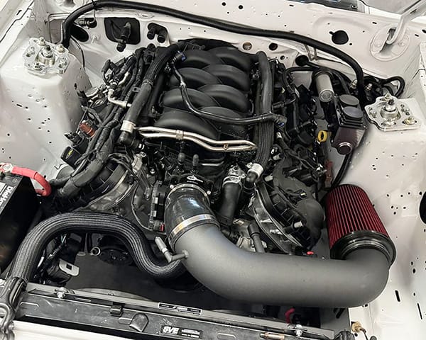 Ford Coyote 5.0 engine installed in Fox Body Mustang with UPR Coyote swap K-member